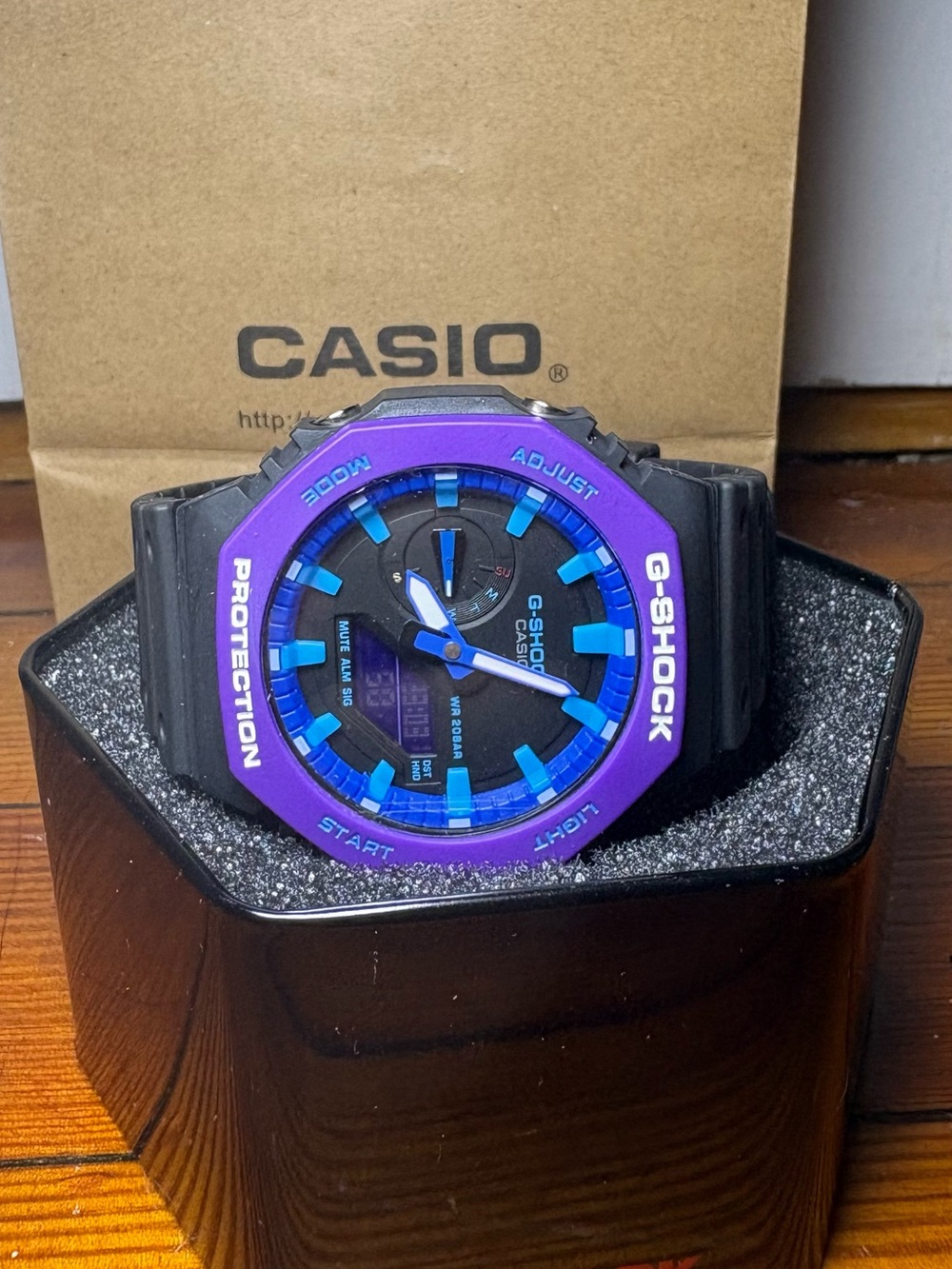 Casio G-Shock Black Watch with Purple Bezel and Blue Accents